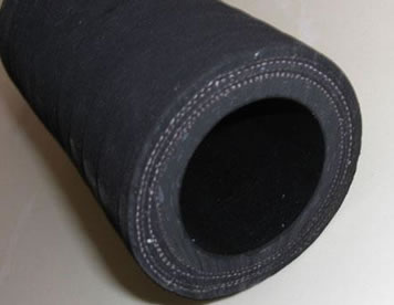 A section of mining sandblast hose is on the floor.