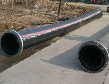 Two sandblast hoses are on the ground.
